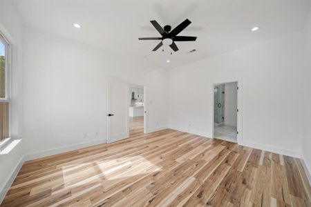 Unfurnished living room featuring light hardwood / wood-style floors and ceiling fan