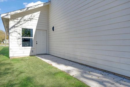 Doorway to property featuring a yard