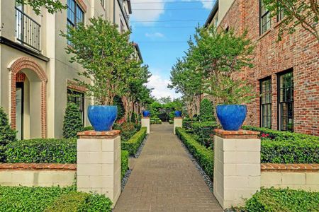 Charming courtyard areas with lush landscaping are situated throughout the neighborhood.