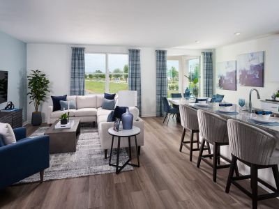 Great room in the Hibiscus floorplan modeled at The Reserve at Twin Lakes