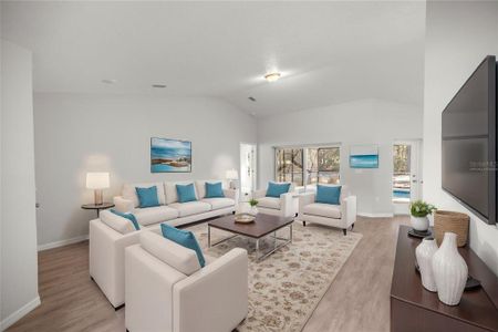 Virtually Staged Living Room overlooking the saltwater pool