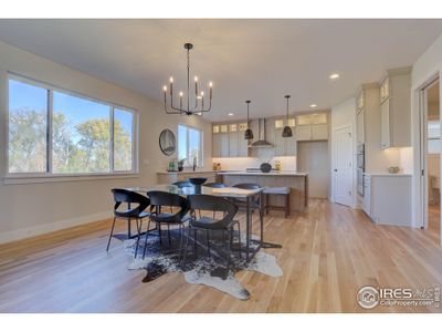 Open dining space and so much natural light to enhance the wood floors