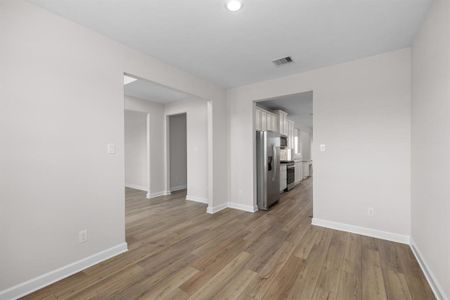 The formal dining room, located just off the kitchen, is perfect for hosting dinner parties and holiday meals.