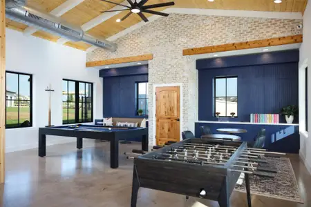 Playroom with billiards, baseboards, high vaulted ceiling, ceiling fan, and concrete flooring