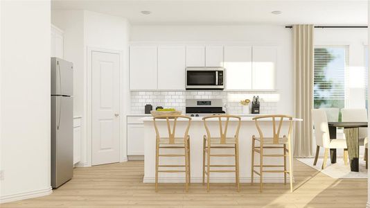 Kitchen featuring light wood-type flooring, white cabinets, a breakfast bar, and stainless steel appliances