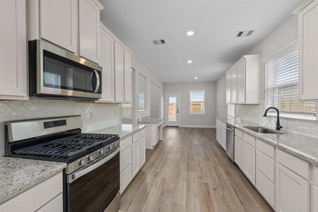 This kitchen is a chef's dream! Ample counter space and cabinets!