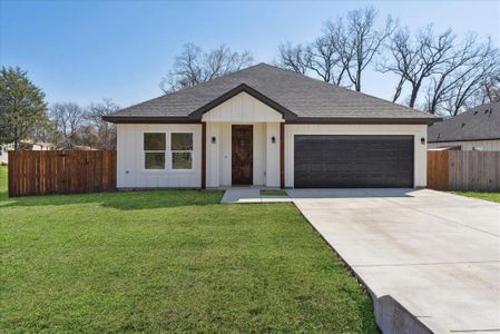 Single story home featuring a front lawn and a garage