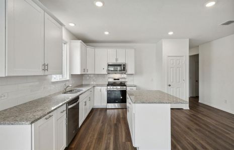 Bright kitchen with premium appliances *real home pictured