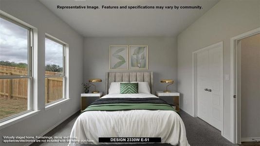 Bedroom featuring carpet floors and multiple windows