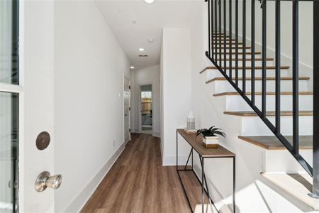 A welcoming entrance with a seamless flow into thoughtfully designed spaces.(Corner model unit is displayed as complete home. This is not the actual unit listed)