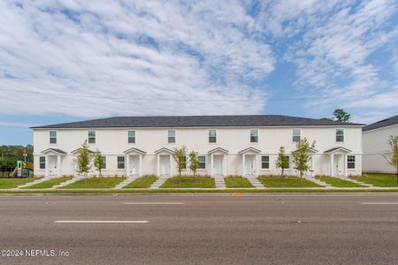 New construction Townhouse house 8510 Mcgirts Village Lane, Jacksonville, FL 32210 - photo 0