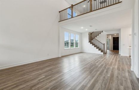 Spacious gathering room with tall ceilings *real home pictured