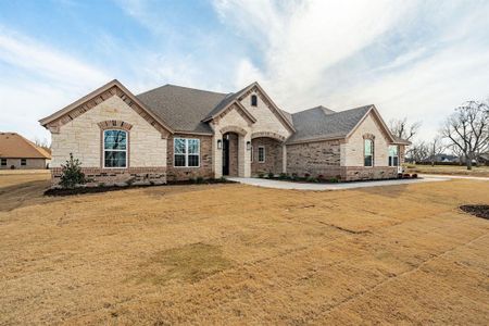 French country style house with a front lawn