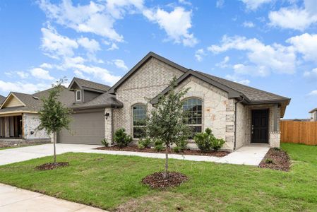 View of front of property featuring a garage and a front lawn