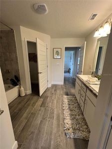 Dual sink bathroom; nestled between two spacious bedrooms