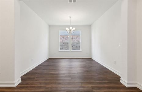 Sunlit dining room with large windows *real home pictured