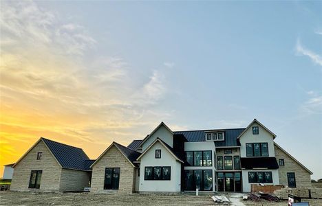 Custom Cut Stone blended with stucco and lots of windows!