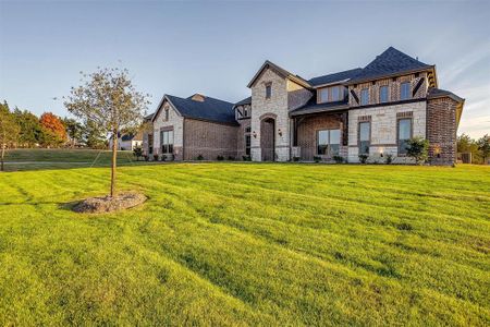 View of front of property with a front yard