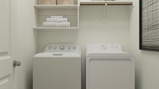 Laundry room with washer and clothes dryer