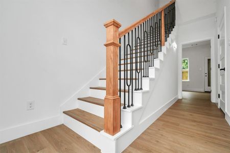 The elongated foyer boats high ceilings and the staircase to the second floor.