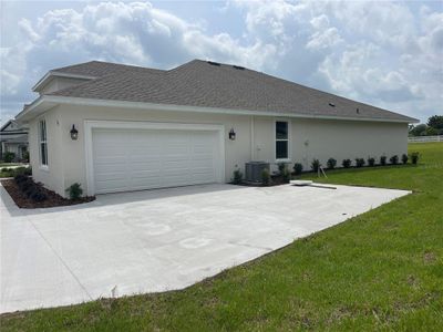 Double car garage on the side of the home