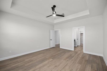 The master bedroom has attractive tray ceiling and a luxurious en-suite bathroom.