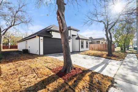 View of side of home featuring a garage