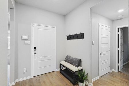 Entryway with light hardwood / wood-style flooring