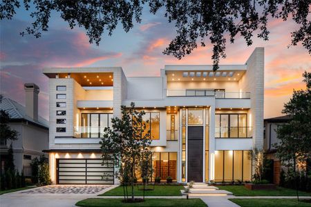 A Glamorous Modern and Sophisticated home with inviting front elevation and lush landscaping. Walk-way with three lit floating front steps, custom steel planters. Oversized pavers. 12' high three car garage with 2 EV charger stations and leak detection system.