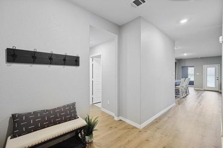 Hallway with wood-type flooring