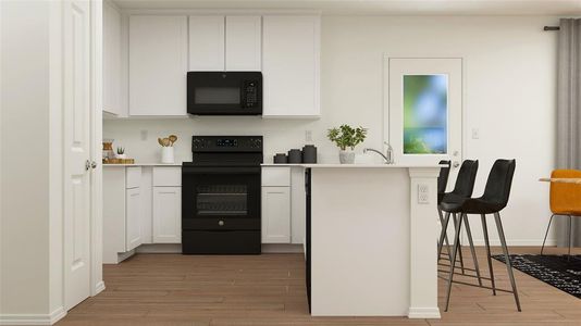 Kitchen with white cabinets, electric range oven, and light wood-type flooring