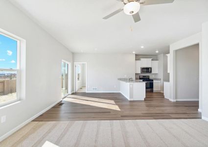 The family room is open to the kitchen and dining room