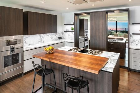 Kitchen cabinetry by Eggersmann. Penthouse appliances are Gaggenau.