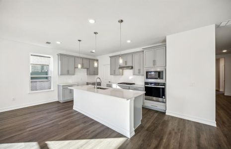 Bright kitchen with oversized island  *real home pictured