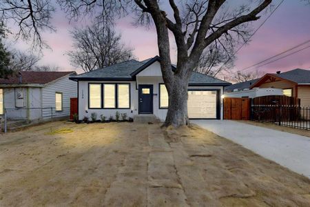 View of front of property with a garage