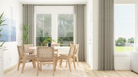 Dining area with light hardwood / wood-style floors