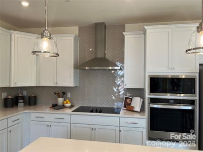 Stainless Hood, Electric Stovetop, Wall Oven & Microwave all included