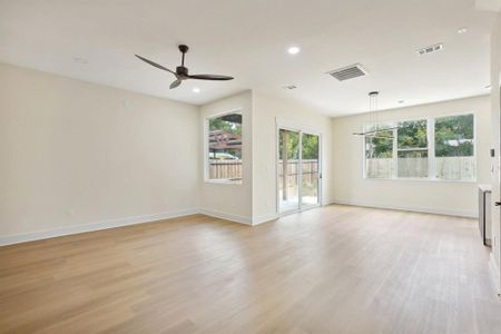 Unfurnished room with light wood-type flooring and ceiling fan