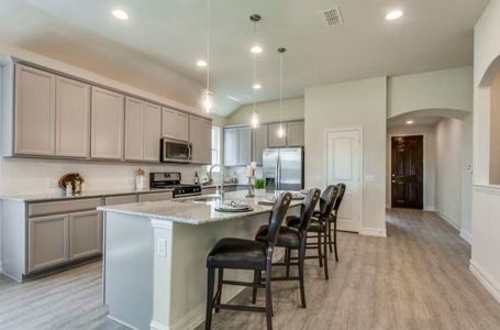 Photo of Pulte model home with same floor plan, not of actual home listed.