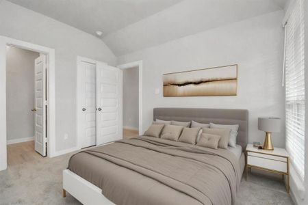 At the forefront of the home, a guest suite with its own bathroom awaits. Sample photo of completed home with similar floor plan. Actual colors and selections may vary.