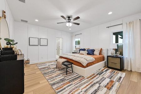 Bedroom with ceiling fan and light wood-type flooring