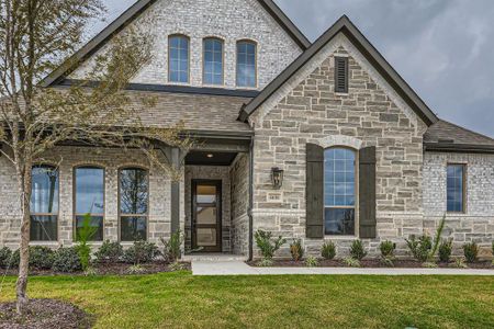 French country style house featuring a front lawn