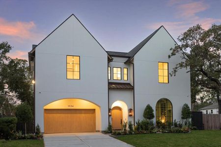 An Oak Forest showplace.  The custom, wood entry door, adorned with Cooper Smith gas coach lanterns in antique copper, Pennsylvania blue porcelain tile and soft neutral accent tones combine for outstanding curb appeal.