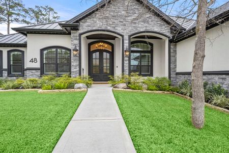 11ft double iron doors with privacy glass and wood ceiling entryway. Plantation shutters and Gemstone lighting around entire home