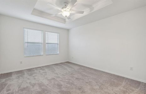 Elegant owner's suite with Tray ceiling *real home pictured