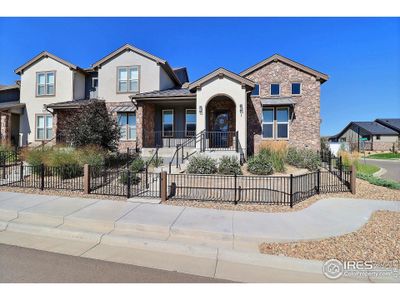 New construction Townhouse house 6246 Vernazza Way, Unit 1, Windsor, CO 80550 - photo 0