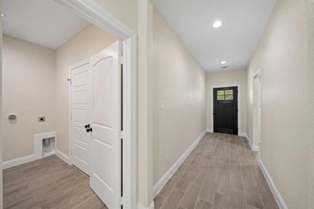 Corridor featuring wood-type flooring