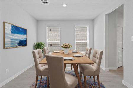 You and your guests will certainly dine in style in this amazing formal dining room! Featuring large windows with blinds, neutral paint, high ceilings, and tile flooring! Perfect space to entertain family and friends!