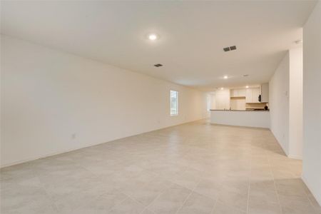 Unfurnished living room with light tile patterned floors