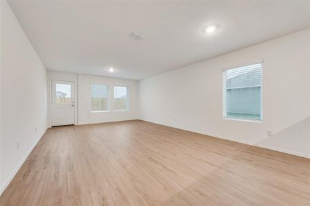 Spare room with light wood-type flooring